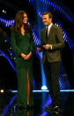 <p>Kate presented an award at the Sports Personality of the Year ceremony wearing a bottle green Alexander McQueen gown. Suede Jimmy Choo pumps completed the look.</p><p><i>[Photo: PA]</i></p>