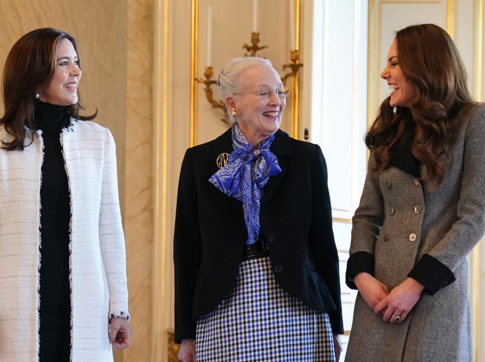 Catherine, Duchess of Cambridge (R) is welcomed by Queen Margrethe II (C) and Crown Princess Mary of Denmark (L) during an audience at Christian IX's Palace on February 23, 2022 in Copenhagen, Denmark.