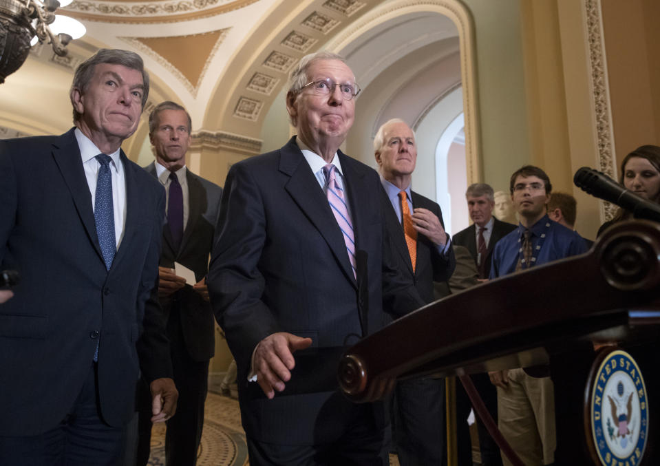 Senate Majority Leader Mitch McConnell, R-Ky., joined from left by Sen. Roy Blunt, R-Mo., Sen. John Thune, R-S.D., and Majority Whip John Cornyn, R-Texas, speaks with reporters about Supreme Court nominee Brett Kavanaugh following their weekly policy meetings, at the Capitol in Washington, Tuesday, Sept. 18, 2018. (AP Photo/J. Scott Applewhite)