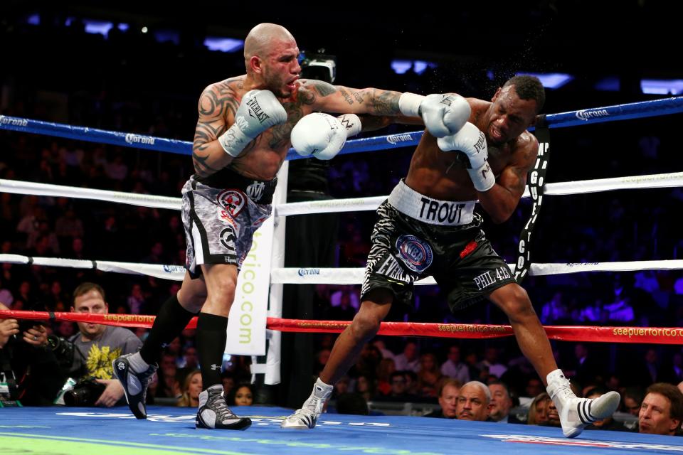 NEW YORK, NY - DECEMBER 01: Austin Trout (R) catches a punch to the face thrown by Miguel Cotto in their WBA Super Welterweight Championship title fight at Madison Square Garden on December 1, 2012 in New York City. (Photo by Elsa/Getty Images)