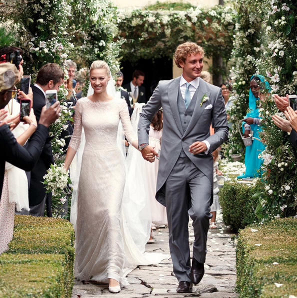 Beatrice Borromeo and Pierre Casiraghi walking down the aisle at their royal wedding. 