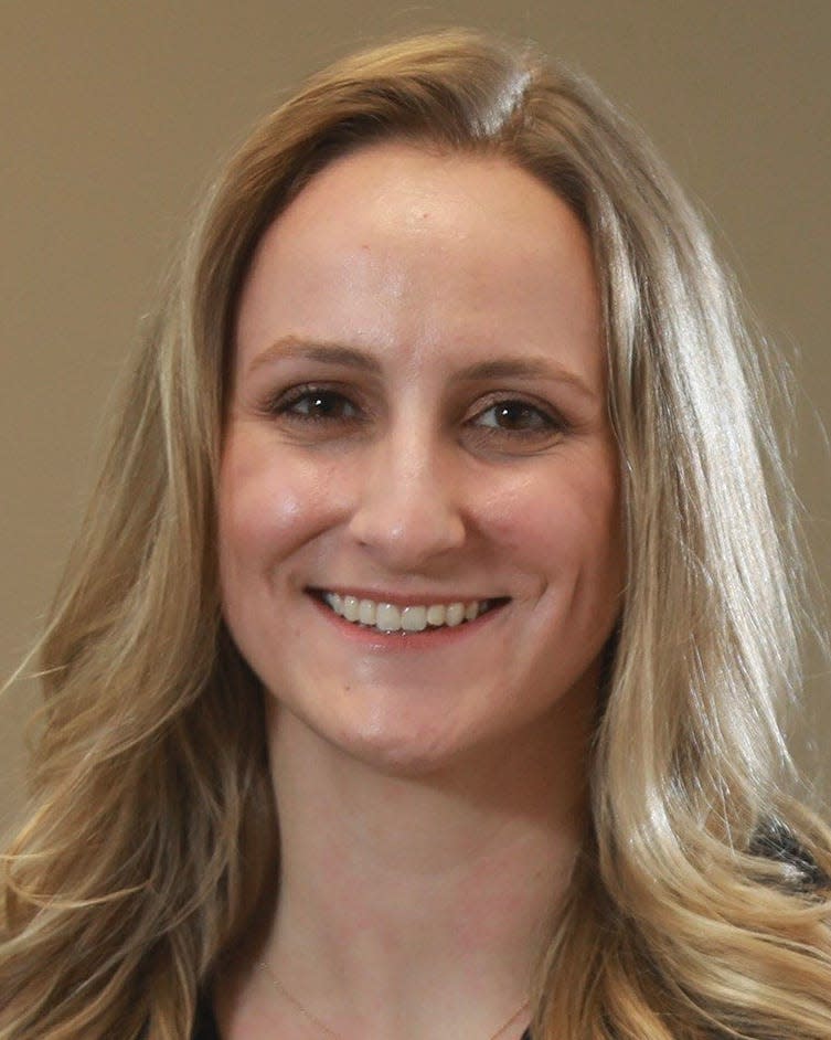 Jennifer Smola is a Columbus Dispatch reporter. She is pictured in the Dispatch newsroom Thursday, April 1, 2021.