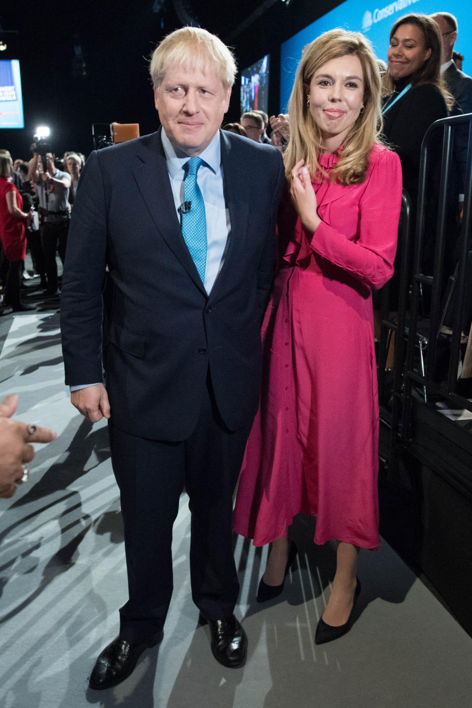 MANCHESTER, ENGLAND - OCTOBER 02: Prime Minister Boris Johnson exits the hall with his girlfriend Carrie Symonds following his keynote speech on day four of the 2019 Conservative Party Conference at Manchester Central on October 2, 2019 in Manchester, England. The U.K. government prepares to formally submit its finalised Brexit plan to the EU today. The offer replaces the Northern Irish Backstop with border, customs and regulatory checks lasting until 2025. (Photo by Stefan Rousseau - WPA Pool /Getty Images)