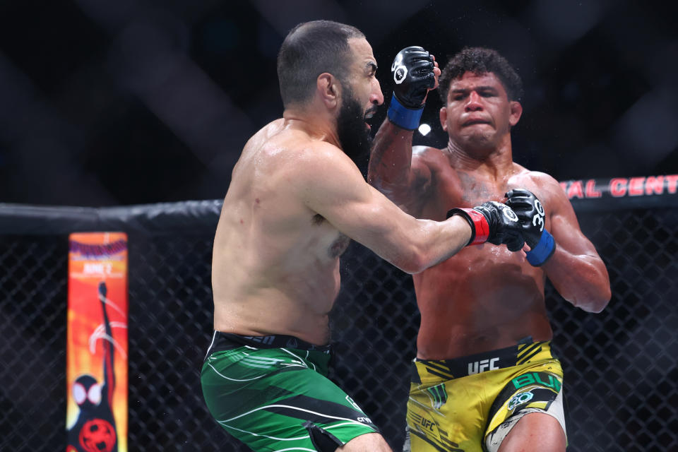May 6, 2023; Newark, New Jersey, USA; Belal Muhammad (red gloves) fights Gilbert Burns (blue gloves) during UFC 288 at Prudential Center. Mandatory Credit: Ed Mulholland-USA TODAY Sports