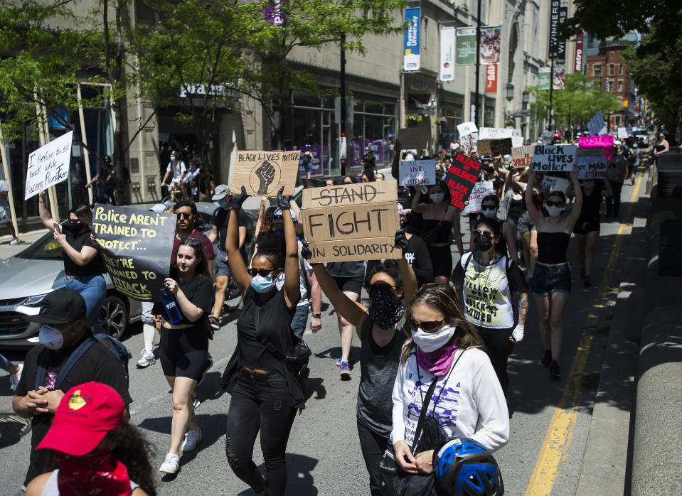 Thousands of people protest at an anti-racism demonstration, in Toronto on Friday, June 5, 2020. George Floyd, a black man, died after he was restrained by Minneapolis police officers on May 25. His death has ignited protests in the U.S. and worldwide over racial injustice and police brutality. (Nathan Denette/The Canadian Press via AP)