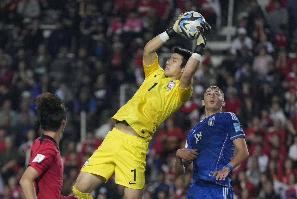 South Korea's goalkeeper Kim Joon-hong makes a save during a FIFA U-20 World Cup semifinal soccer match against Italy at Diego Maradona stadium in La Plata, Argentina, Thursday, June 8, 2023. (AP Photo/Natacha Pisarenko)