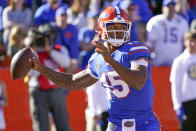 Florida quarterback Anthony Richardson looks for a receiver during the second half of an NCAA college football game against Florida State, Saturday, Nov. 27, 2021, in Gainesville, Fla. (AP Photo/John Raoux)