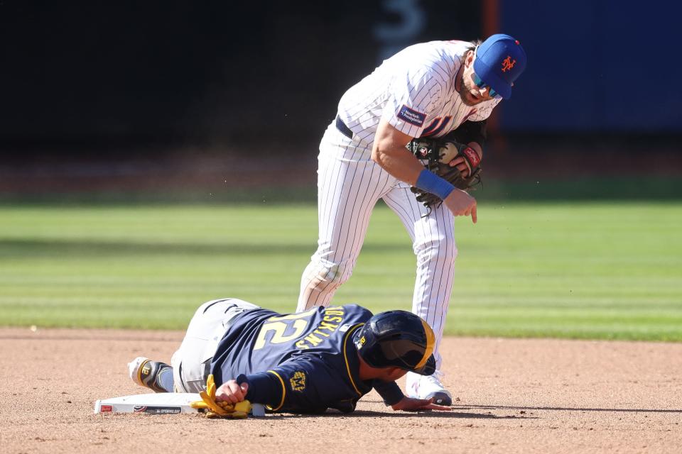 Mar 29, 2024; New York City, New York, USA; New York Mets second baseman Jeff McNeil (1) reacts after forcing out Milwaukee Brewers first baseman Rhys Hoskins (12) during the eighth inning at Citi Field. Mandatory Credit: Vincent Carchietta-USA TODAY Sports