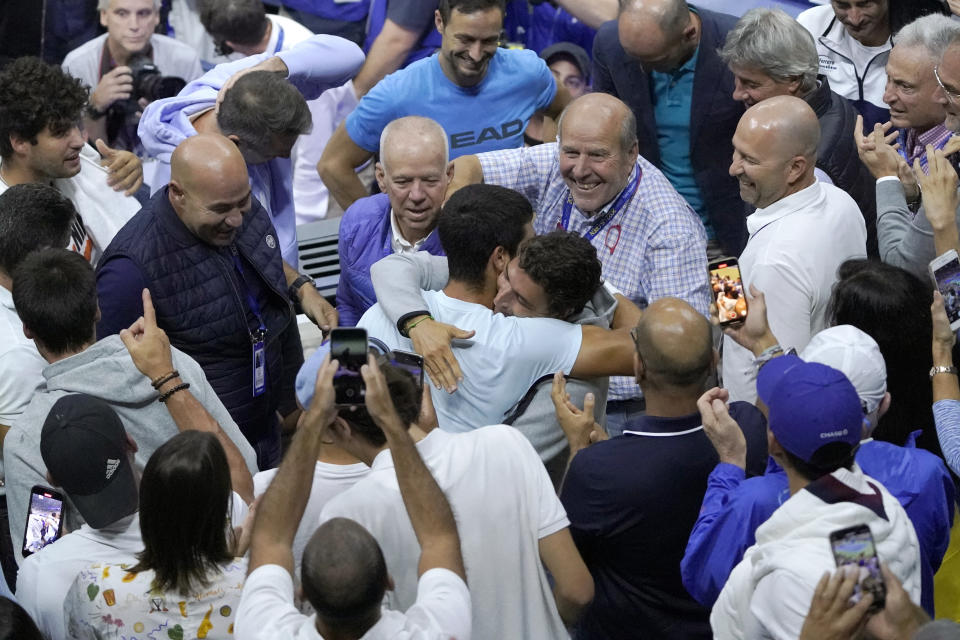 Carlos Alcaraz, of Spain, embraces supporters after defeating Casper Ruud, of Norway, to win the men's singles final of the U.S. Open tennis championships, Sunday, Sept. 11, 2022, in New York. (AP Photo/Mary Altaffer)