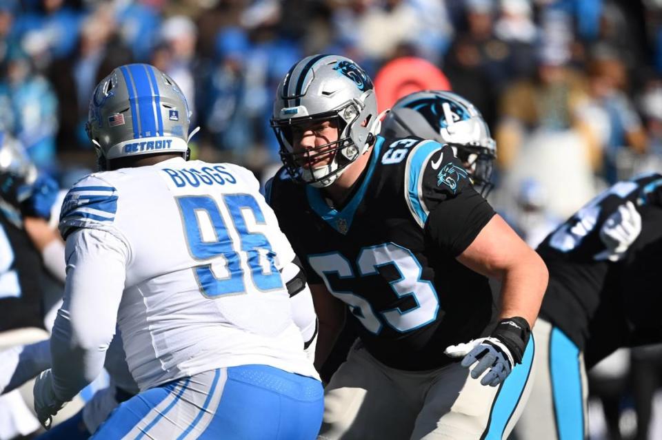 Dec 24, 2022; Charlotte, North Carolina, USA; Carolina Panthers guard Austin Corbett (63) and Detroit Lions defensive end Isaiah Buggs (96) at the line of scrimmage in the second quarter at Bank of America Stadium. Mandatory Credit: Bob Donnan-USA TODAY Sports