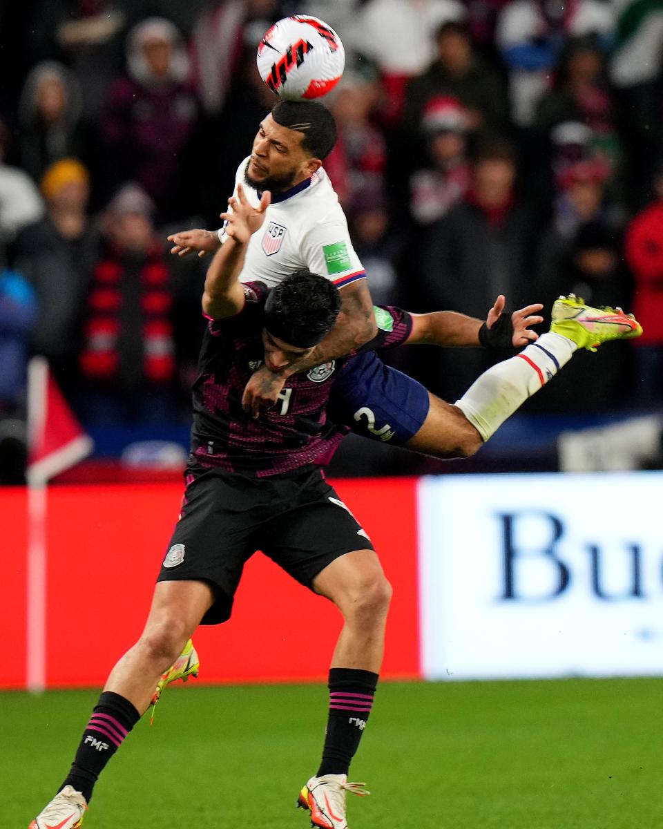 DeAndre Yedlin #2 of the United States goes for a head ball challenge against Raul Jimenez #9 of Mexico during the first half of a 2022 World Cup CONCACAF qualifying match, Friday, Nov. 12, 2021, at TQL Stadium in Cincinnati. United States won against Mexico, 2-0.