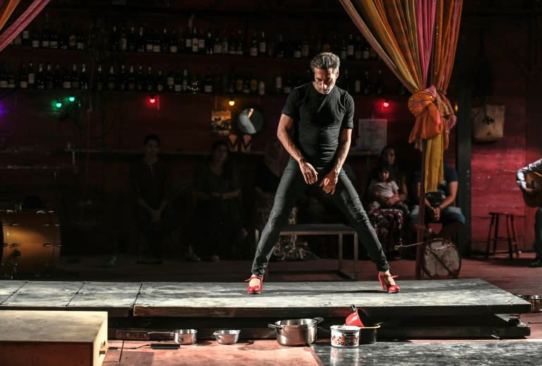 Galvan, who has often horrified flamenco purists, dances in red high heels for part of the show