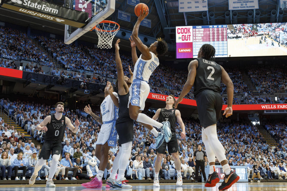North Carolina's Harrison Ingram (55) attempts a shot during the first half of an NCAA college basketball game against Virginia Tech in Chapel Hill, N.C., Saturday, Feb. 17, 2024. (AP Photo/Ben McKeown)