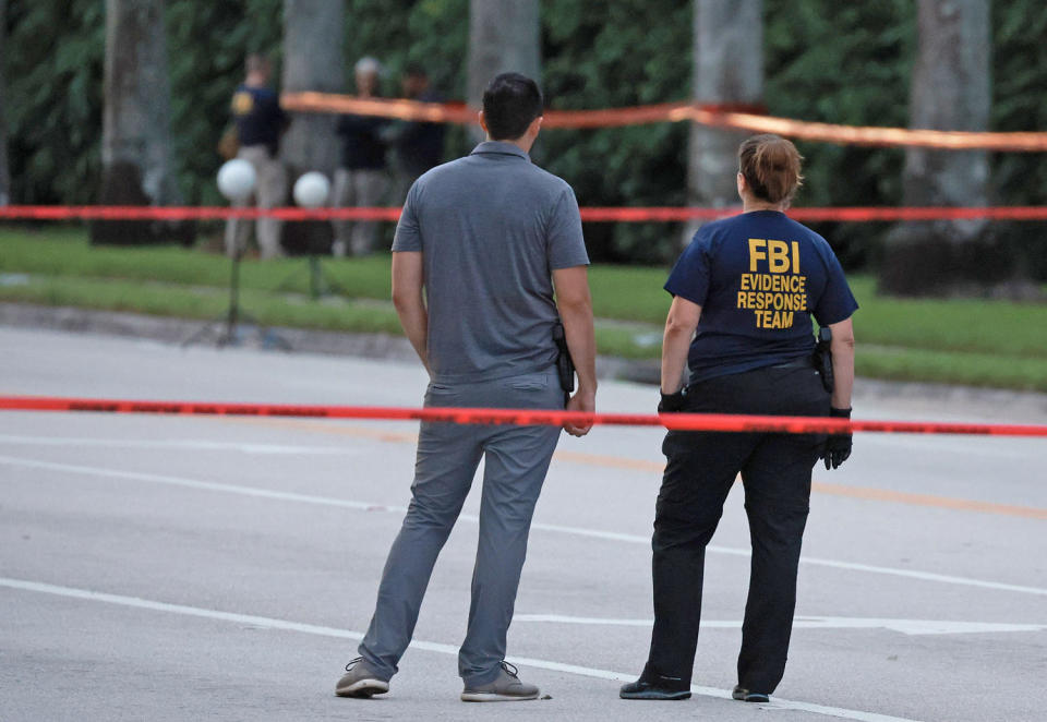 Law enforcement personnel investigate the area around Trump International Golf Club (Joe Raedle / Getty Images)