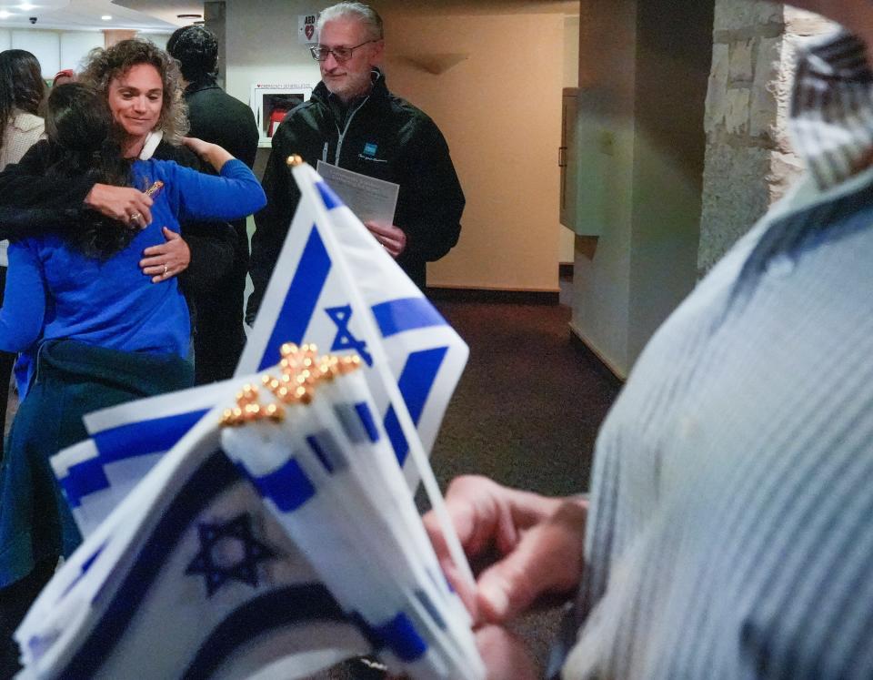 Rhonda Lindner embraces Sami Stein Avner, blue shirt, prior to the community solidarity gathering for Israel Monday, Oct. 9, 2023, at Congregation Shalom in Fox Point.