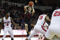 San Diego State's Malachi Flynn shoots next to Fresno State's Orlando Robinson (1) during the first half of an NCAA college basketball game in Fresno, Calif., Tuesday Jan. 14, 2020. (AP Photo/Gary Kazanjian)