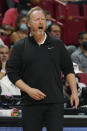 Milwaukee Bucks head coach Mike Budenholzer screams from the sidelines during the second half of an NBA basketball game against the Miami Heat, Wednesday, Dec. 8, 2021, in Miami. (AP Photo/Marta Lavandier)