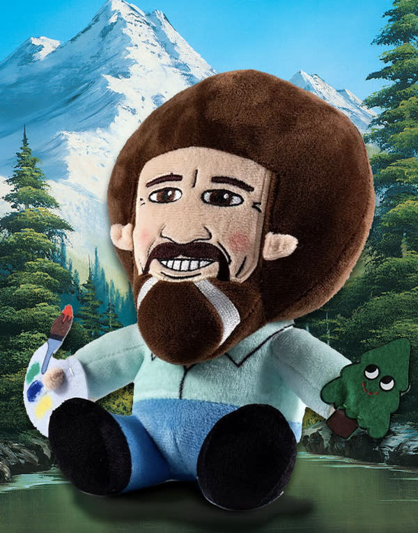 Comes with a plush, blanket, apron, pillow, stress ball and magnet set. All Bob Ross. (Photo: Loot Crate)