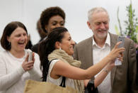 Britain's Labour Party leader Jeremy Corbyn (R) stops to have his picture taken with supporters after a meeting of the National Executive Committee in central London, Britain July 12, 2016. REUTERS/Paul Hackett