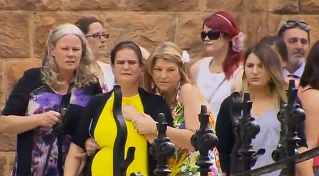 Mourners comfort each other at the funeral of Zoe Buttigieg on Tuesday. Photo: 7News