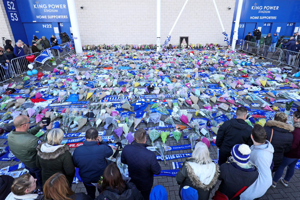 Supporters pay tribute at Leicester City Football Club following the helicopter crash. (Aaron Chown/PA Wire)