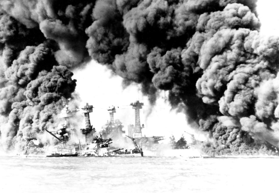 The West Virginia and Tennessee battleships are ablaze after the Pearl Harbor attack Dec. 7, 1941. (Photo: Photo 12 via Getty Images)