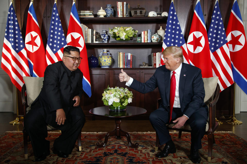 FILE - In this June 12, 2018 file photo, President Donald Trump meets with North Korean leader Kim Jong Un on Sentosa Island, Tuesday, June 12, 2018, in Singapore. With their second summit fast approaching, speculation is growing that Trump may try to persuade Kim to commit to denuclearization by giving him something he wants more than almost anything else, an announcement of peace and an end to the Korean War.(AP Photo/Evan Vucci)