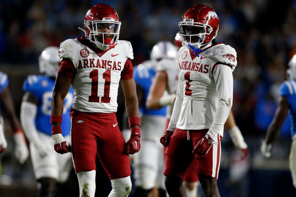 Oct 7, 2023; Oxford, Mississippi, USA; Arkansas Razorbacks defensive backs Jaylon Braxton (11) and Lorando Johnson (1) react after a pass break up during the first half against the Mississippi Rebels at Vaught-Hemingway Stadium. Mandatory Credit: Petre Thomas-USA TODAY Sports