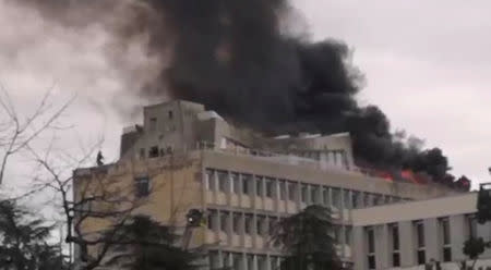 Firefighters extinguish the fire that broke out on the rooftop of Lyon university, in Lyon, France January 17, 2019, in this still image obtained from a social media video. Twitter/ @PODEUS69 via REUTERS ATTENTION EDITORS - THIS IMAGE HAS BEEN SUPPLIED BY A THIRD PARTY. MANDATORY CREDIT.