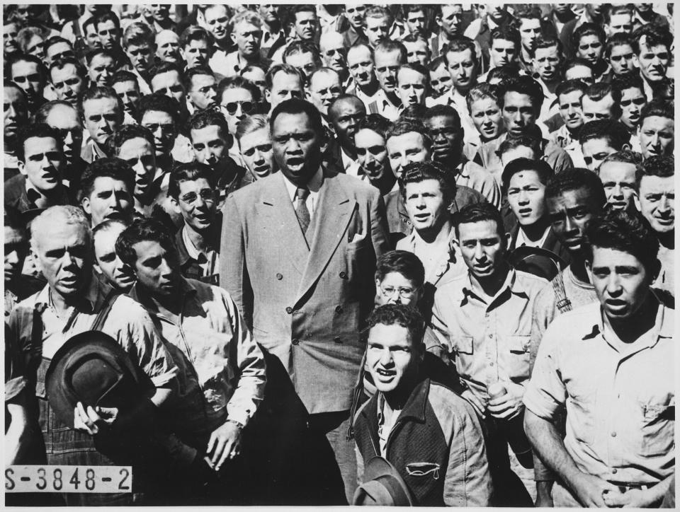 In a 1942 picture in the National Archives, leads workers at Moore Shipyard in Oakland, Calif., in singing "The Star-Spangled Banner."

"This is a serious job---winning this war against fascists," he told workers. "We have to be together."