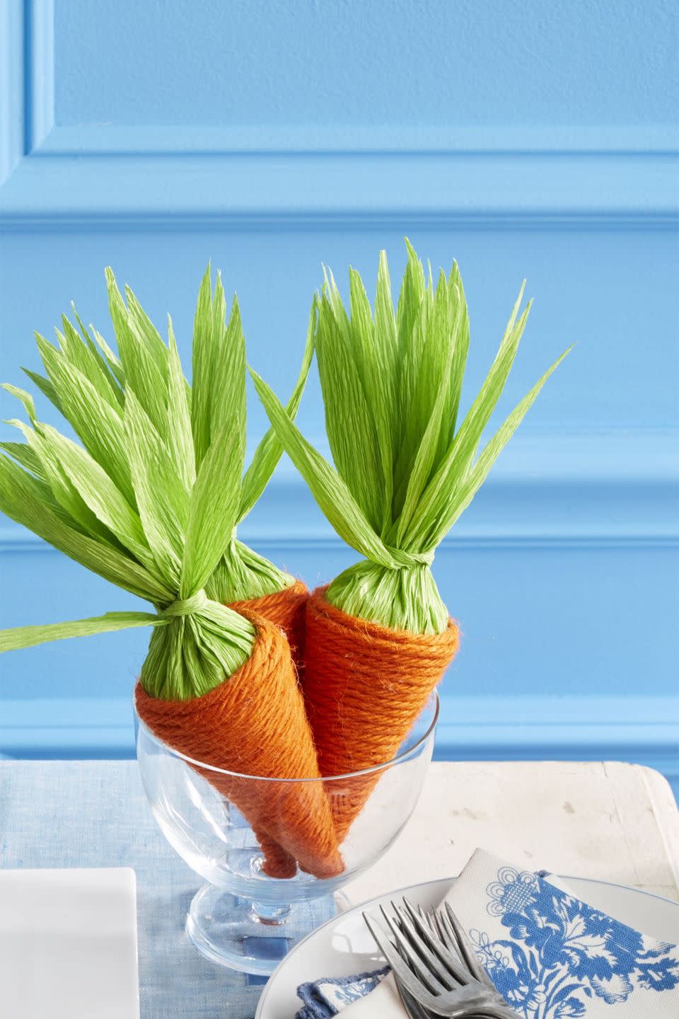 <p>Package Easter treats inside papier-mache cones wrapped in orange twine and topped with green crepe paper.</p><p><strong><em><a href="https://www.womansday.com/home/crafts-projects/how-to/a58123/how-to-make-carrot-candy-holders/" rel="nofollow noopener" target="_blank" data-ylk="slk:Get the Candy Carrots tutorial.;elm:context_link;itc:0;sec:content-canvas" class="link ">Get the Candy Carrots tutorial.</a></em></strong></p><p><strong><a class="link " href="https://www.amazon.com/dp/B01HV94U9Y/ref=sspa_dk_detail_2?psc=1&pd_rd_i=B01HV94U9Y&pd_rd_w=qIjvL&pf_rd_p=b34bfa80-68f6-4e86-a996-32f7afe08deb&pd_rd_wg=8ojDU&pf_rd_r=TFMZVR72Q6EFSXP06VWA&pd_rd_r=de42df1f-7973-42de-a0ef-1329c50bbc2e&spLa=ZW5jcnlwdGVkUXVhbGlmaWVyPUE1TVhSMlM2QUNEOTQmZW5jcnlwdGVkSWQ9QTA2Nzc5MDkxVlIwTUNYNk4wOVJGJmVuY3J5cHRlZEFkSWQ9QTAwMTQ3ODAxQVJBTTFQRlZONzQzJndpZGdldE5hbWU9c3BfZGV0YWlsJmFjdGlvbj1jbGlja1JlZGlyZWN0JmRvTm90TG9nQ2xpY2s9dHJ1ZQ%3D%3D&tag=syn-yahoo-20&ascsubtag=%5Bartid%7C10070.g.1751%5Bsrc%7Cyahoo-us" rel="nofollow noopener" target="_blank" data-ylk="slk:SHOP ORANGE TWINE;elm:context_link;itc:0;sec:content-canvas">SHOP ORANGE TWINE</a></strong></p>