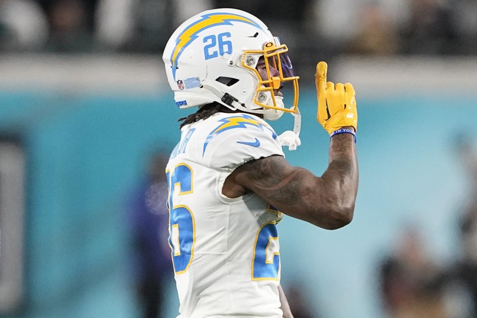 Los Angeles Chargers cornerback Asante Samuel Jr. (26) celebrates breaking up a pass against the Jacksonville Jaguars during the first half of an NFL wild-card football game, Saturday, Jan. 14, 2023, in Jacksonville, Fla. (AP Photo/Chris Carlson)