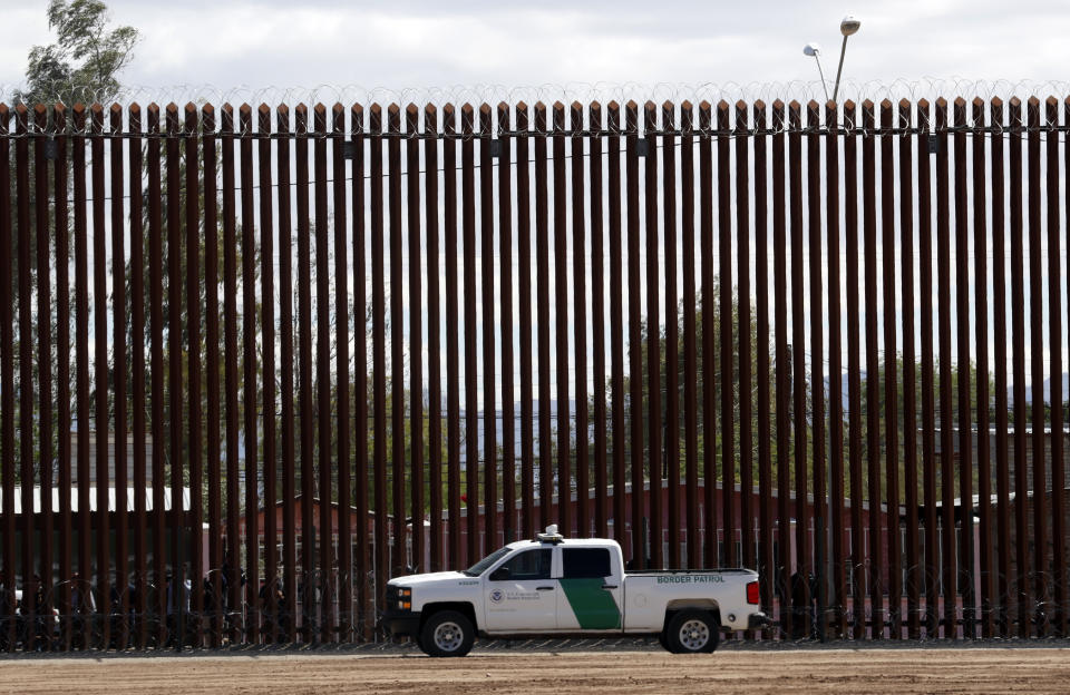 A U.S. Customs and Border Protection vehicle sits near the wall as President Donald Trump visits a new section of the border wall with Mexico in Calexico, Calif., Friday April 5, 2019. (AP Photo/Jacquelyn Martin)