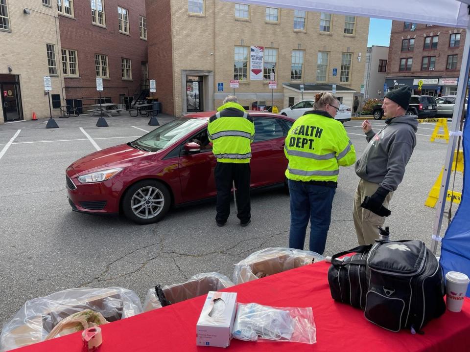 Framingham police officers assist residents seeking to drop off unwanted prescription drugs during last year's National Drug Take Back Day.