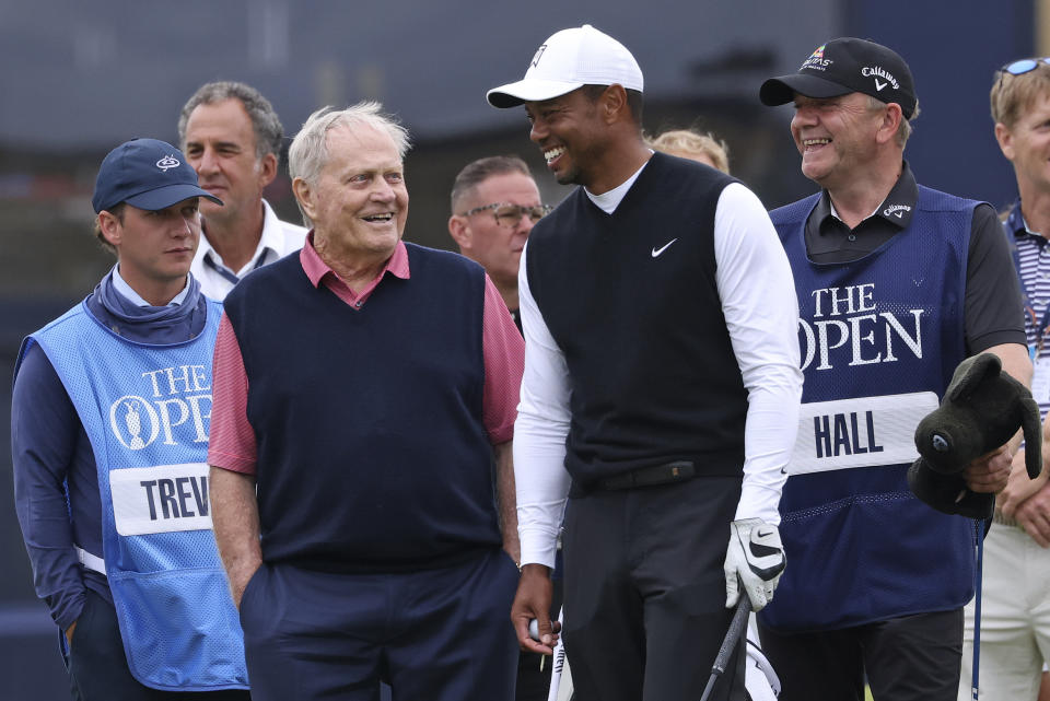 Tiger Woods of the US, and Jack Nicklaus, chat during a 'Champions round' as preparations continue for the British Open golf championship on the Old Course at St. Andrews, Scotland, Monday July 11, 2022. The Open Championship returns to the home of golf on July 14-17, 2022, to celebrate the 150th edition of the sport's oldest championship, which dates to 1860 and was first played at St. Andrews in 1873. (AP Photo/Peter Morrison)