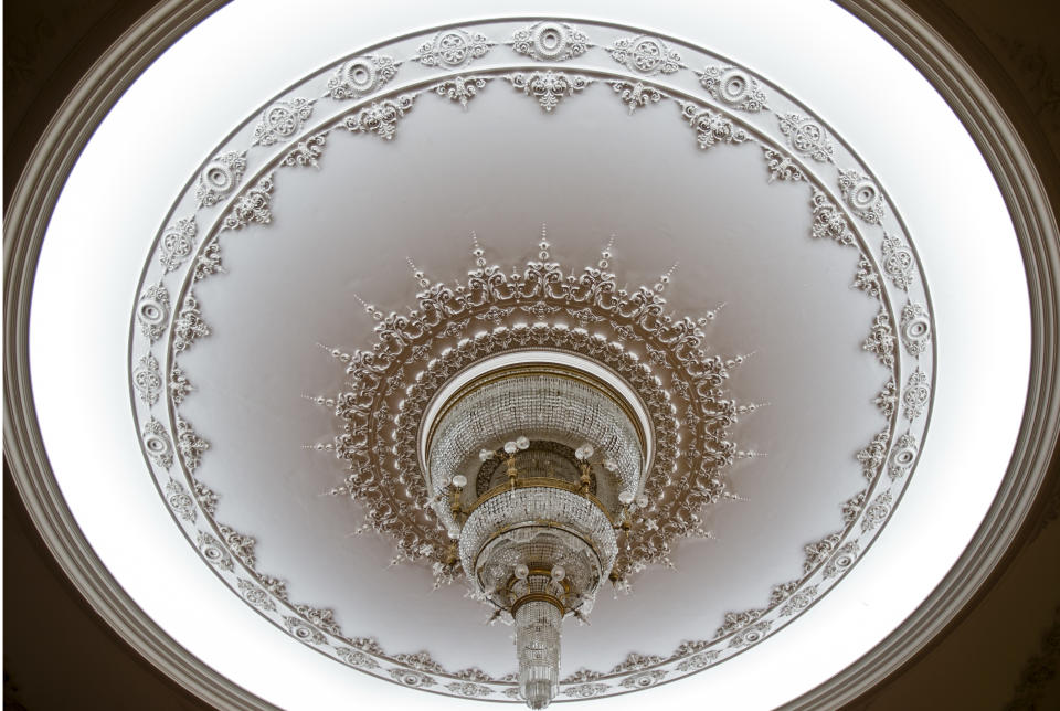 A picture taken on Dec. 12, 2012, shows a ceiling lamp at the Parliament Palace in Bucharest, Romania. Twenty-three years after communism collapsed, the Palace of the Parliament, a gargantuan Stalinist symbol and the most concrete legacy of ex-dictator Nicolae Ceausescu, has emerged as an unlikely pillar of Romania's nascent democracy. And while it remains one of the most controversial projects of Ceausescu's 25-year rule, albeit one that has gradually found a place in the nation's psyche, it's also now a tourist attraction, visited by tens of thousands of Romanians and foreigners every year. (AP Photo/Vadim Ghirda)