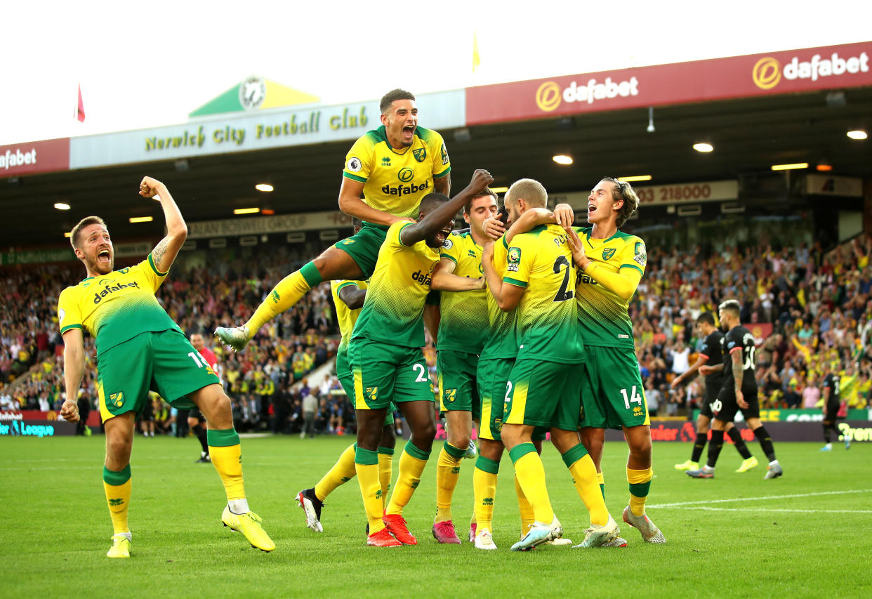 Norwich City players celebrate with Teemu Pukki after his goal against City. (Photo by Marc Atkins/Getty Images)