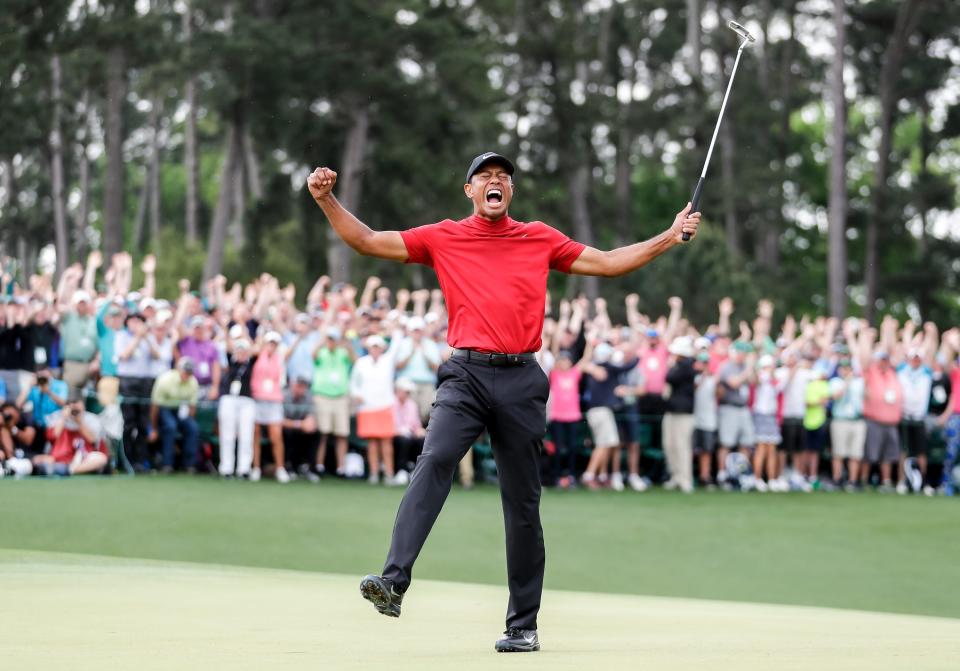 FILE - Tiger Woods celebrates winning the 2019 Masters during the final round of the Masters Tournament at Augusta National Golf Club, Sunday, April 14, 2019. Woods still holds the record for youngest ever Masters champion since his 1997 win.