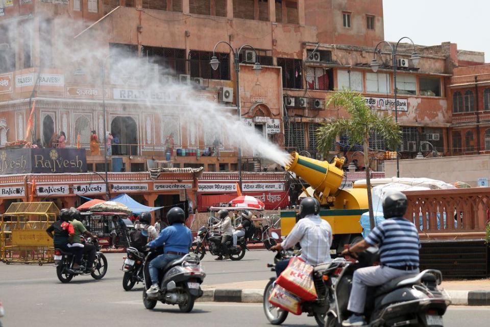 A vehicle of the Jaipur Municipal Corporation Heritage is spraying water mist to provide relief from the scorching sun on a hot summer day, in Jaipur, Rajasthan, India, on May 15, 2024. (Photo by Vishal Bhatnagar/NurPhoto via Getty Images)