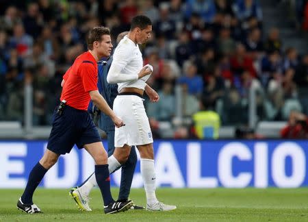 Football - Italy v England - International Friendly - Juventus Stadium, Turin, Italy - 31/3/15 England's Chris Smalling goes off after sustaining an injury Action Images via Reuters / Carl Recine Livepic