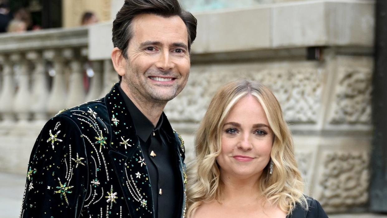 David Tennant in an embellished velvet suit and Georgia Tennant in a black dress