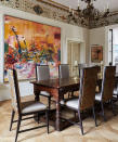 <p> ‘The dining room has become the social hub of the home,' explains interior designer, Emma Sims Hilditch. 'Opt for natural tones such as soft browns, gentle greys and creamy nudes which serve as a beautiful base for interchangeable soft furnishings. Try adding bright patterned cushions to a dining room chair, or colorful artwork to a bare wall.' In this room, gray dining room ideas have been warmed up by brown wooden furniture and an abstract artwork filled with fiery oranges and reds.  </p>