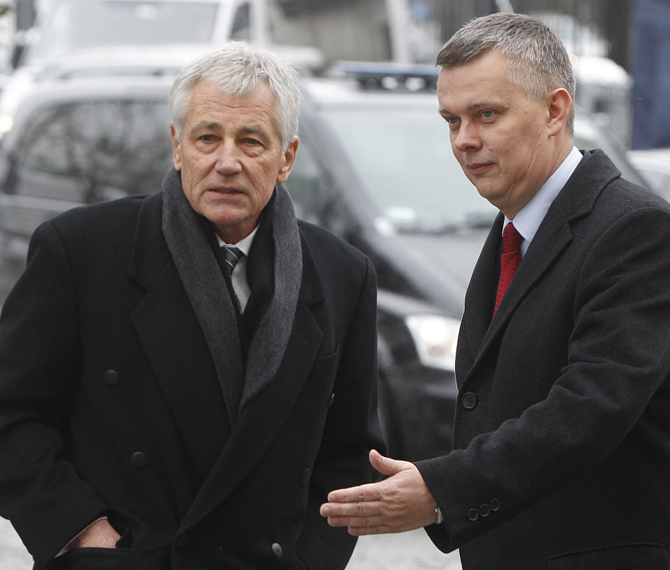 US Secretary of Defense Chuck Hagel, left, is welcomed by Polish Defense Minister Tomasz Siemoniak at the beginning of their meeting in Warsaw, Poland, Thursday, Jan. 30, 2014. Hagel is meeting with his Polish counterpart for talks on cooperation in the defense and global security. (AP Photo/Czarek Sokolowski)