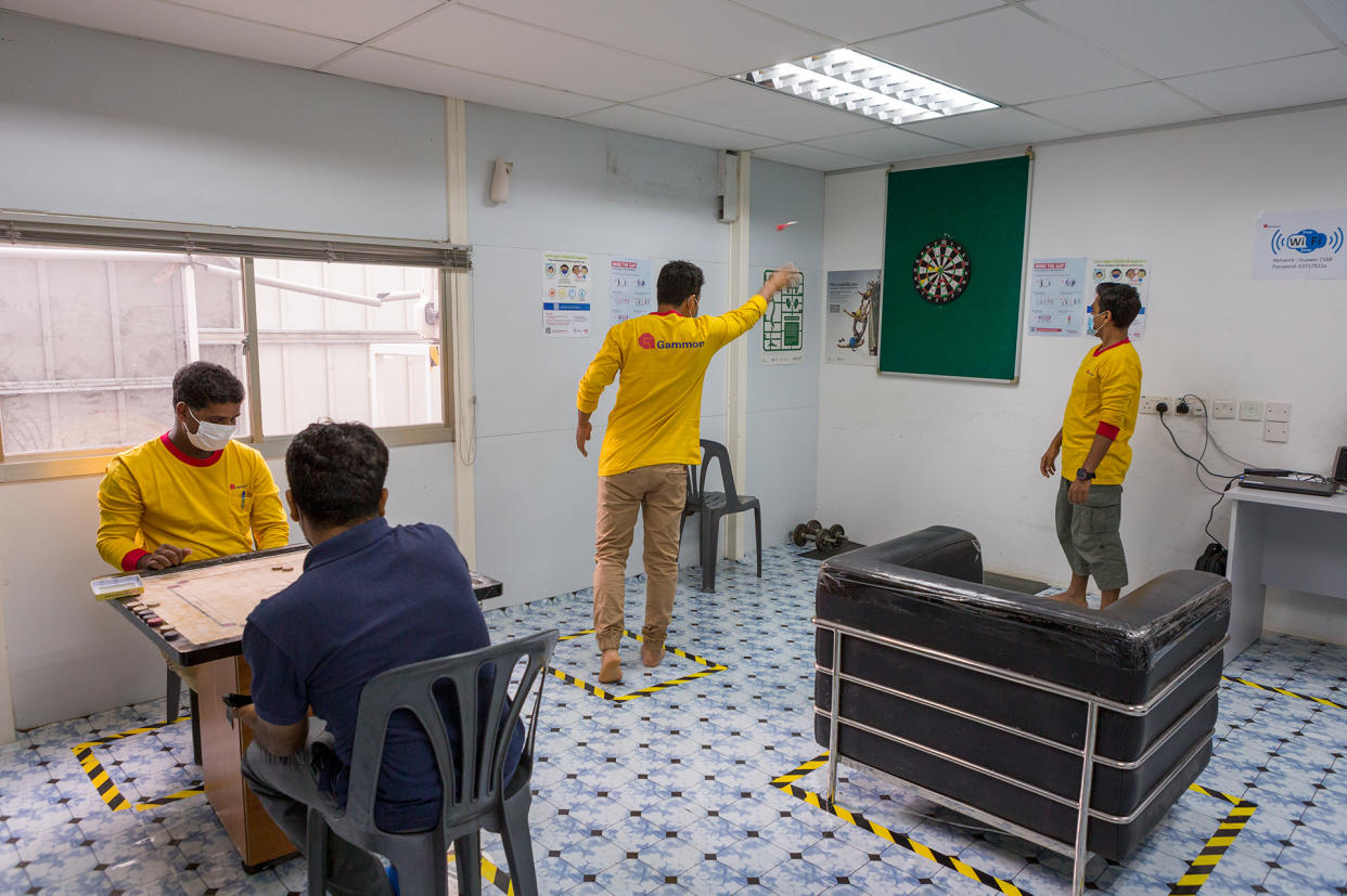 Migrant workers using the recreation room inside the temporary living quarters set up at the Havelock MRT station construction site. (PHOTO: Dhany Osman / Yahoo News Singapore)