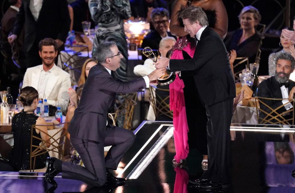 John Oliver accepts his 2022 Emmy from Martin Short (Invision)