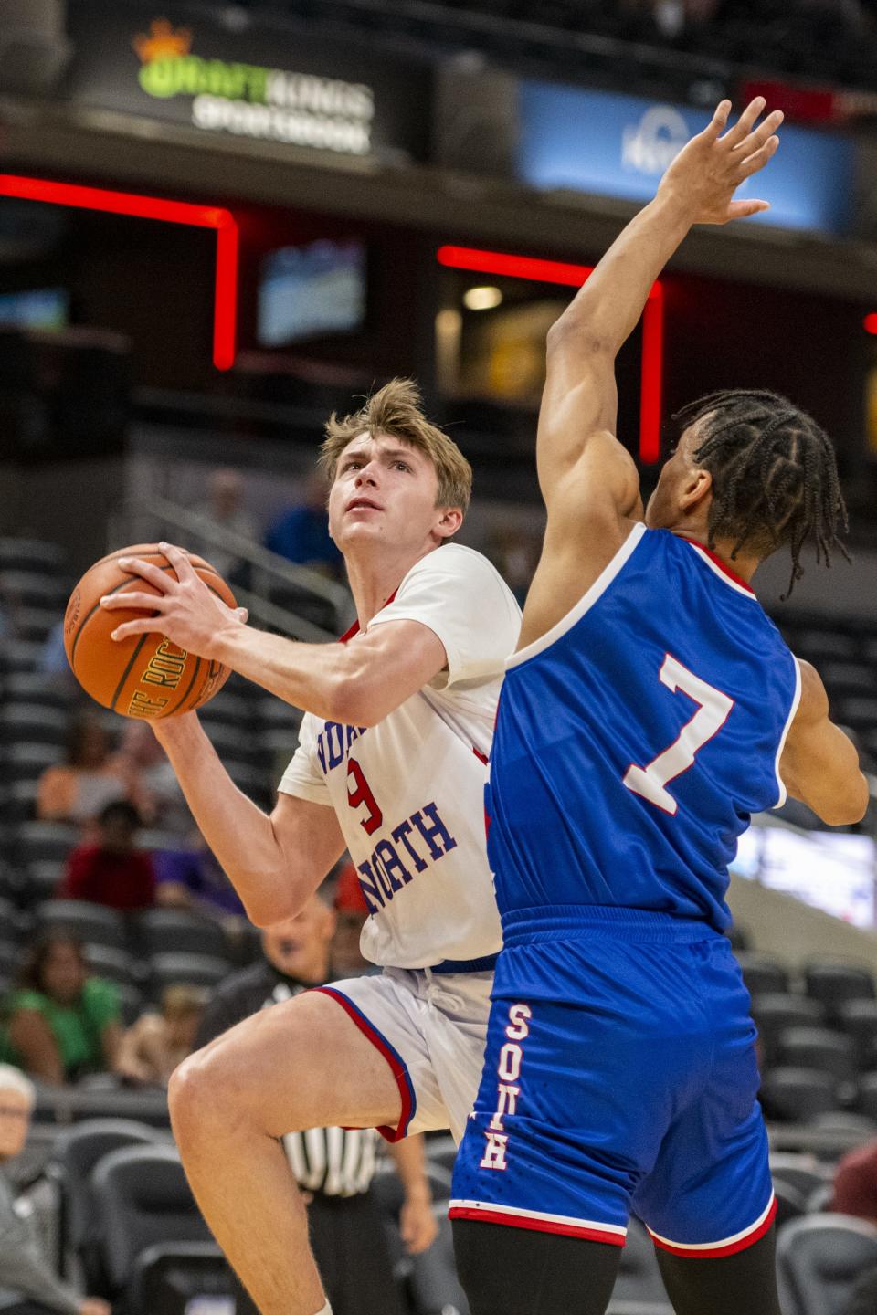 North Future All-Star Chase Konieczny (9), a sophomore from South Bend St. Joseph High School, shoots while being defended by South Future All-Star K.J. Windham (7), a junior from Ben Davis High School, during the first half of an boysâ€™ Indiana High School Future All-Stars basketball game, Saturday, June 10, 2023, at Gainbridge Fieldhouse, in Indianapolis.