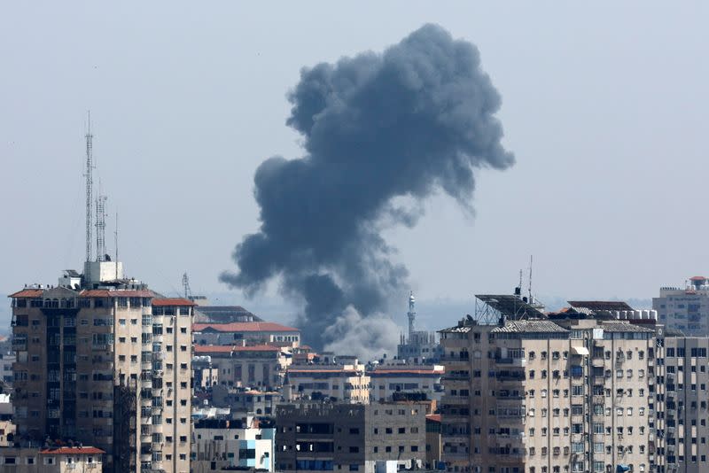 Smoke rises following an Israeli strike, in Gaza