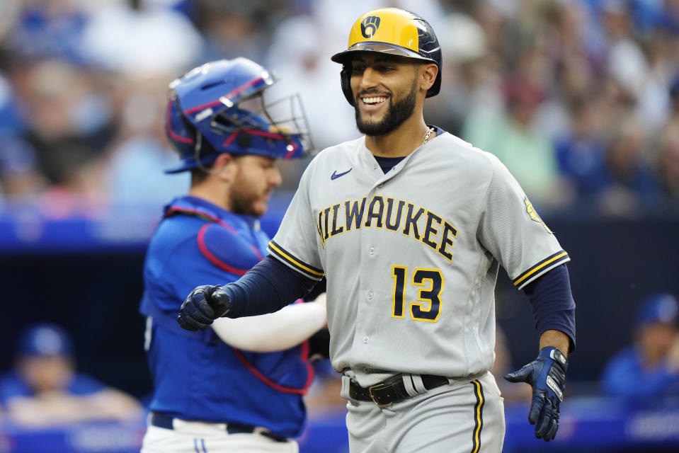 Milwaukee Brewers' Abraham Toro (13) celebrates his two-run home run against the Toronto Blue Jays during the second inning of a baseball game Wednesday, May 31, 2023, in Toronto. (Frank Gunn/The Canadian Press via AP)