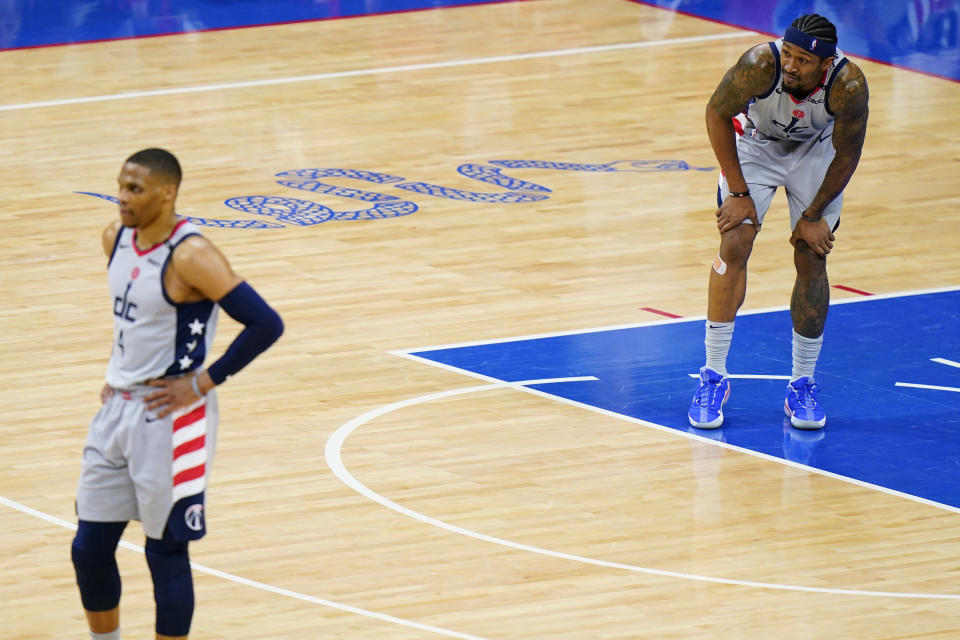 Washington Wizards' Bradley Beal, right, and Russell Westbrook watch as the Philadelphia 76ers attempt a free-throw during the second half of Game 5 in a first-round NBA basketball playoff series, Wednesday, June 2, 2021, in Philadelphia. (AP Photo/Matt Slocum)