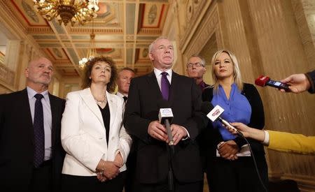 Sinn Fein's Martin McGuinness (C) speaks to the media in Parliament buildings in Belfast Northern Ireland September 9, 2015. REUTERS/Cathal McNaughton